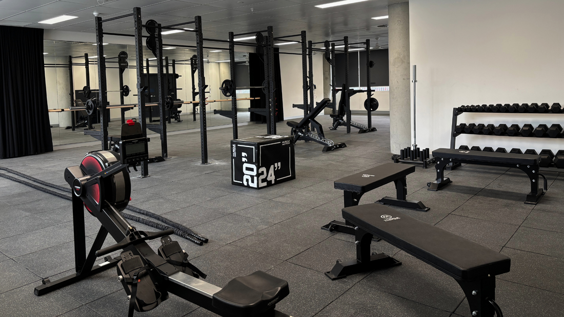 A modern gym interior with various workout equipment.