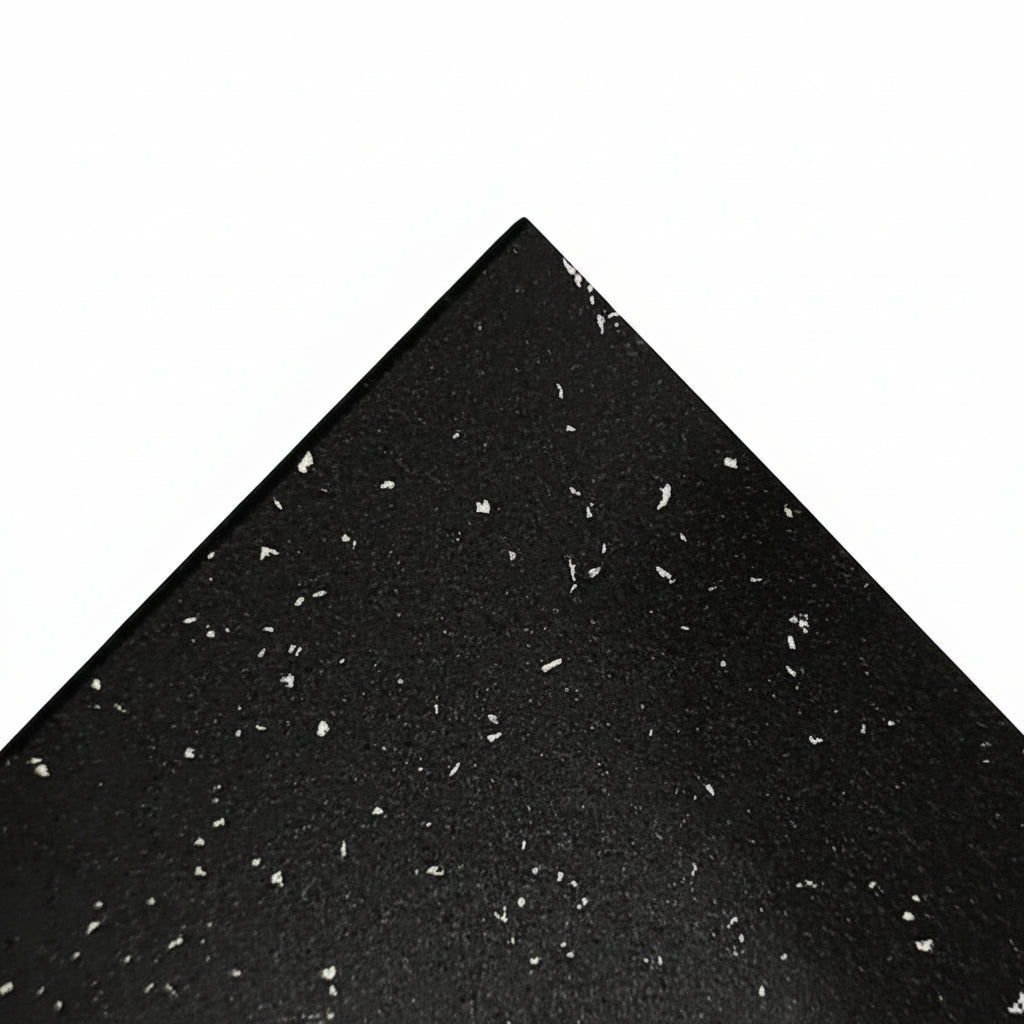 Black material with small white specks on a white background